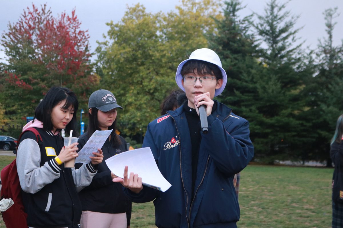 A team leader hosting a game with a microphone